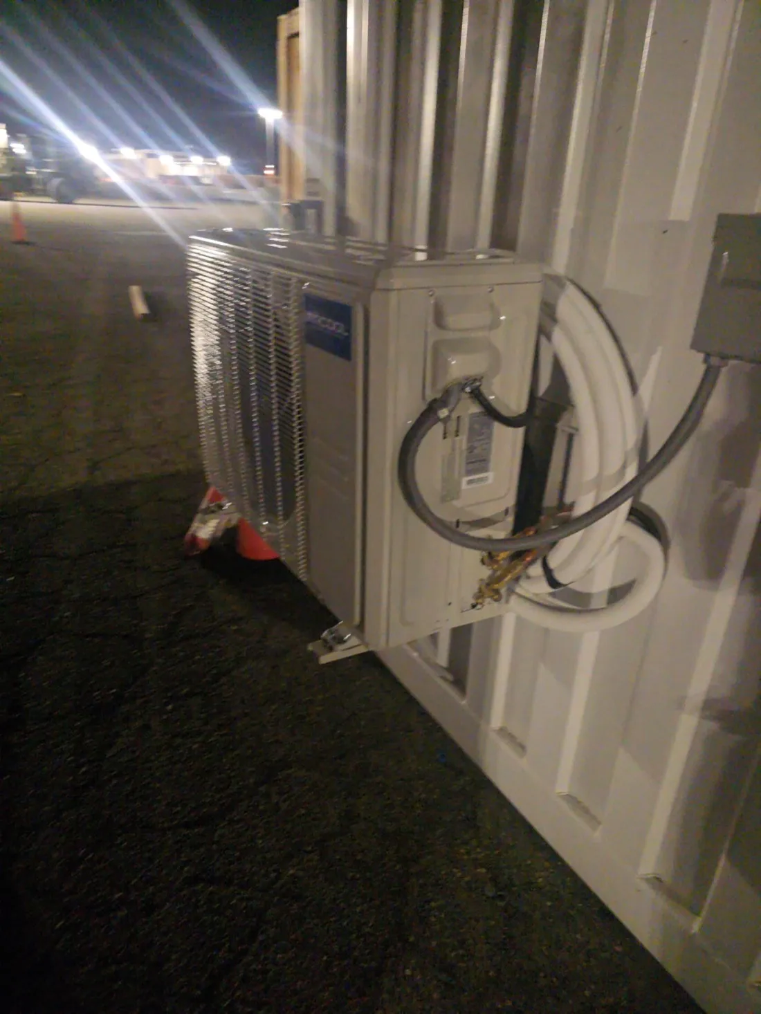 Outdoor mini-split AC unit installed with properly connected refrigerant and electrical lines โ Zomg The Handyman