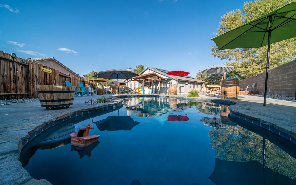 Backyard pool with an umbrella